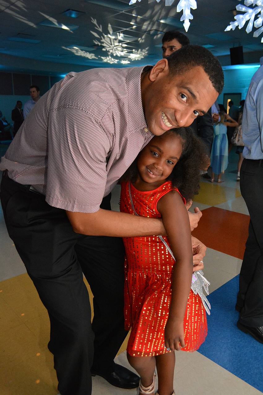 Mark and Myla Bryan enjoy the snowflake them while dancing.