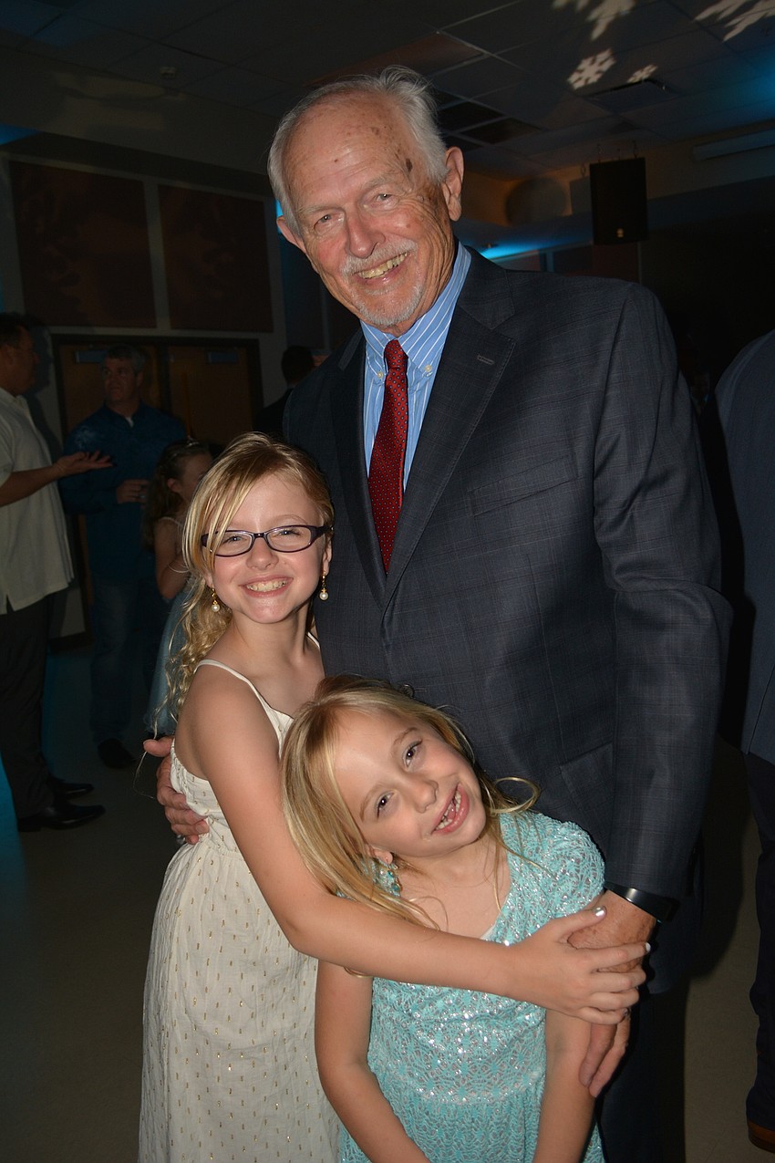 Bill Hogan takes his granddaughters, Kennedy and Shiloh Woods.