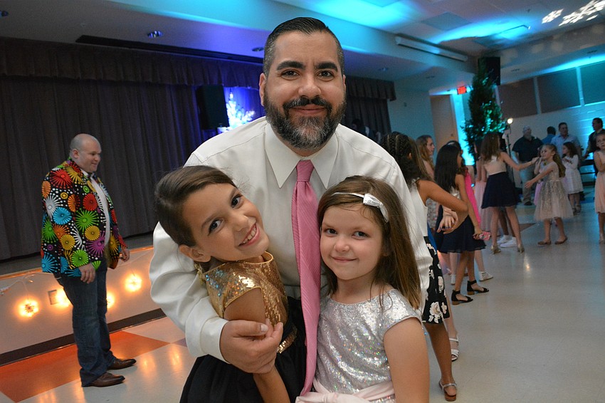 Audrey, Nick and Chloe Rowe hit the dance floor. 