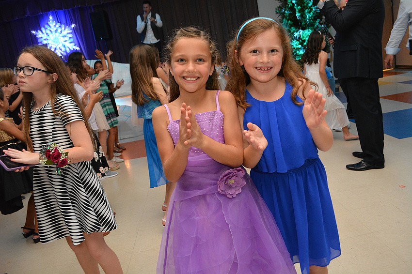 Avery Peterson and Natalie Ghazarian, both 8, show off their dance moves.