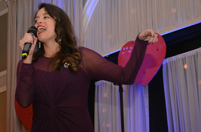 The Players' Cassandra Santiso sets the atmosphere with songs such as "Unforgettable."