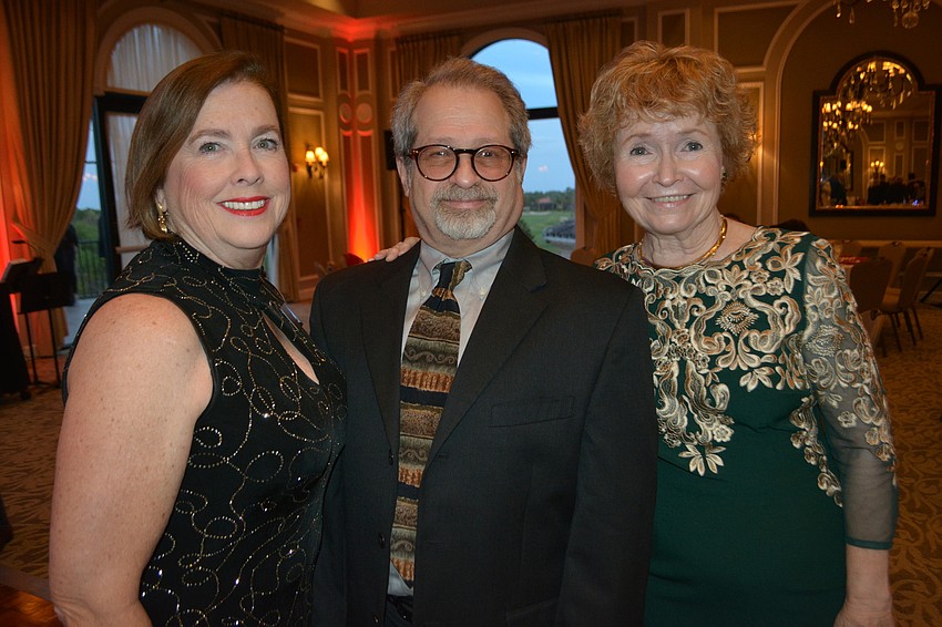 Players board member Donna DeFant, Elliott Raines of Two Chairs Theatre Company and Pam Wiley, a director at The Players, mingle before dinner.