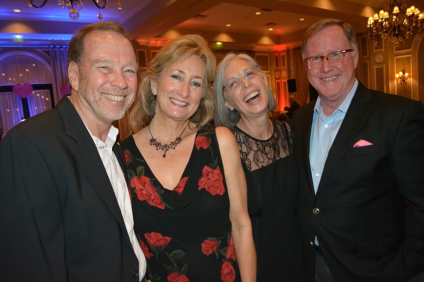 Lakewood Ranch Development's Bob Simons and his wife, Leigh, and John and Kathryn Hart share a laugh before the entertainment begins at Smitten.