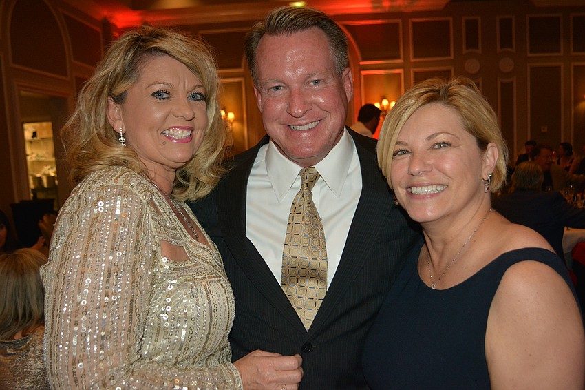 Peggy Kronus, Jerry Lamb and Angela Massaro-Fain share a laugh following dinner.