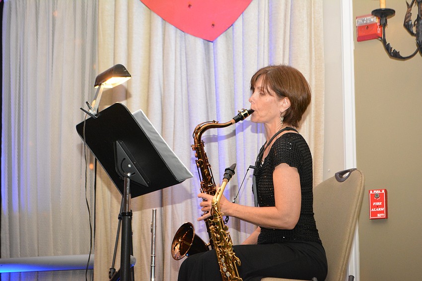 The Players' Teri Booth does a little wailing on the sax.