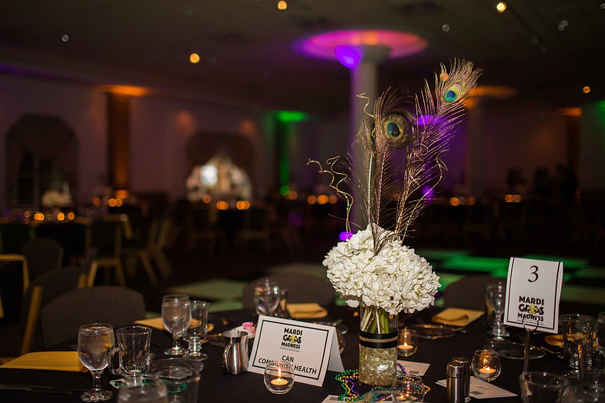 The ballroom of Michael's On East was decorated with green and purple.
