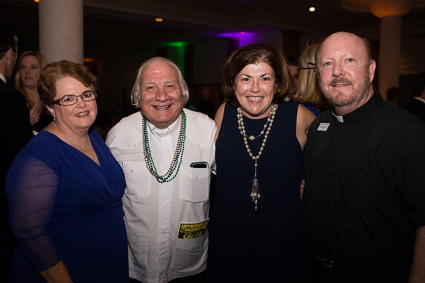 Chairwoman Terri Maze, Father Fausto Stampiglia, Colleen McMenamin and Father Patrick Wilson