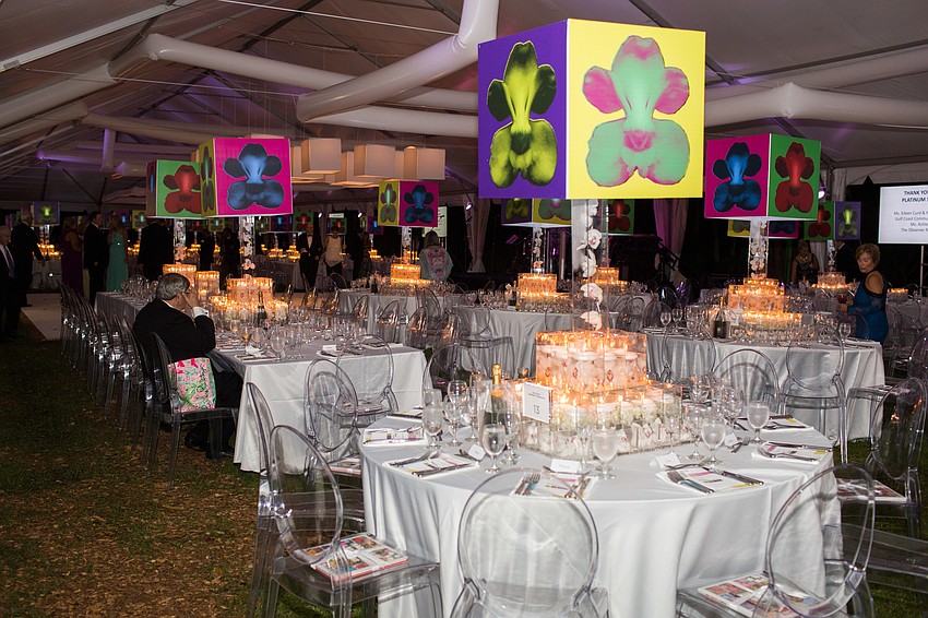 The pops of color from the centerpieces stood out from the white ceiling, tables and tent.