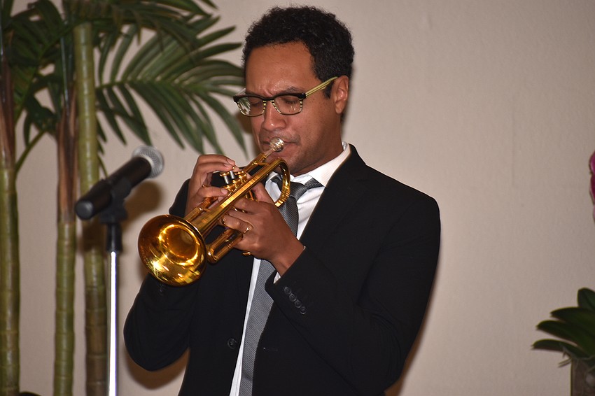 James Suggs plays a trumpet solo during the service.