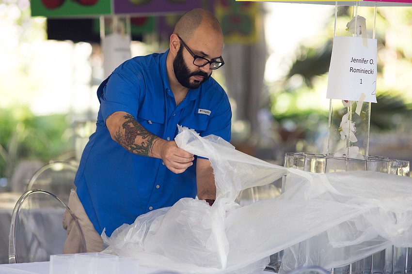 The night before Orchid Ball, Capote wrapped each table in plastic to keep the condensation off the white tablecloths.