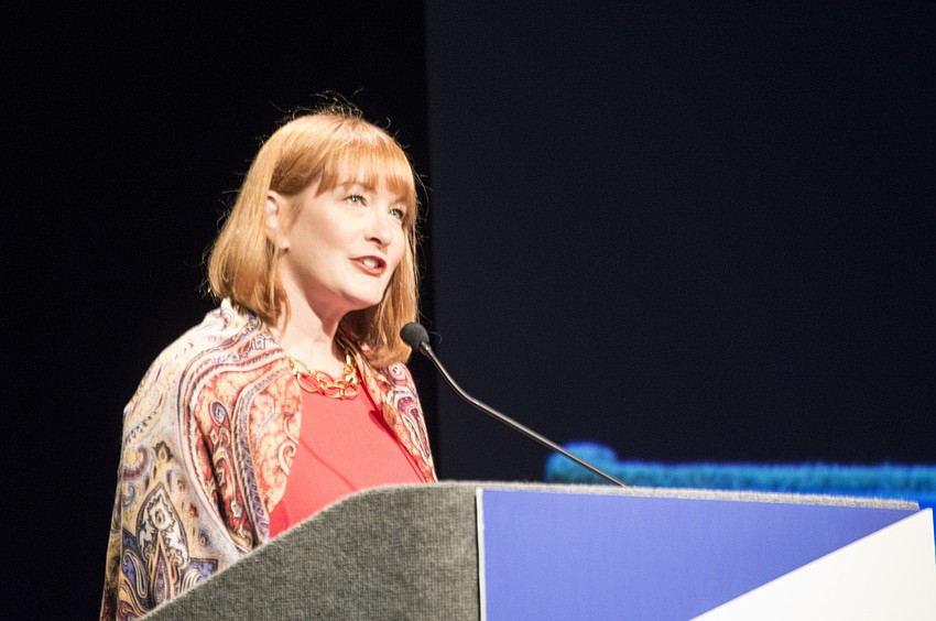 RCLA Town Hall Committee Chair Emily Walsh introduces the lecture.