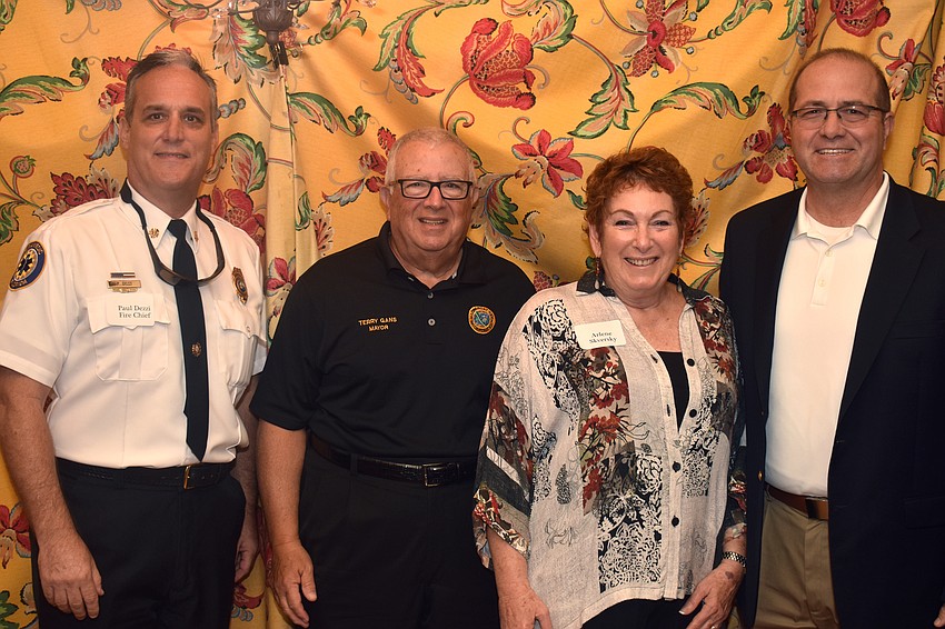 Longboat Key Fire Rescue Chief Paul Dezzi, Mayor Terry Gans, Democratic Club Vice President Arlene Skversky and Town Manager Tom Harmer