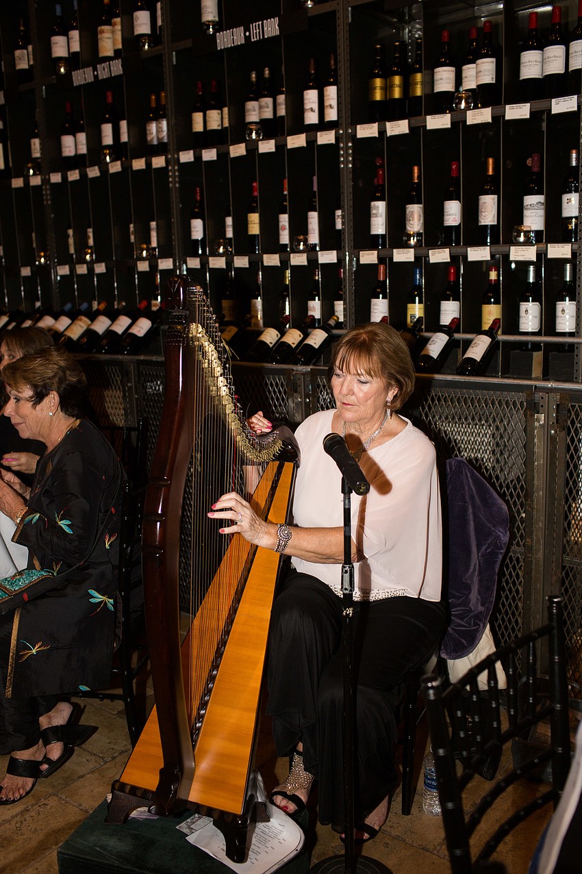 Olivia Swaan played musical pieces on the harp during the reception.