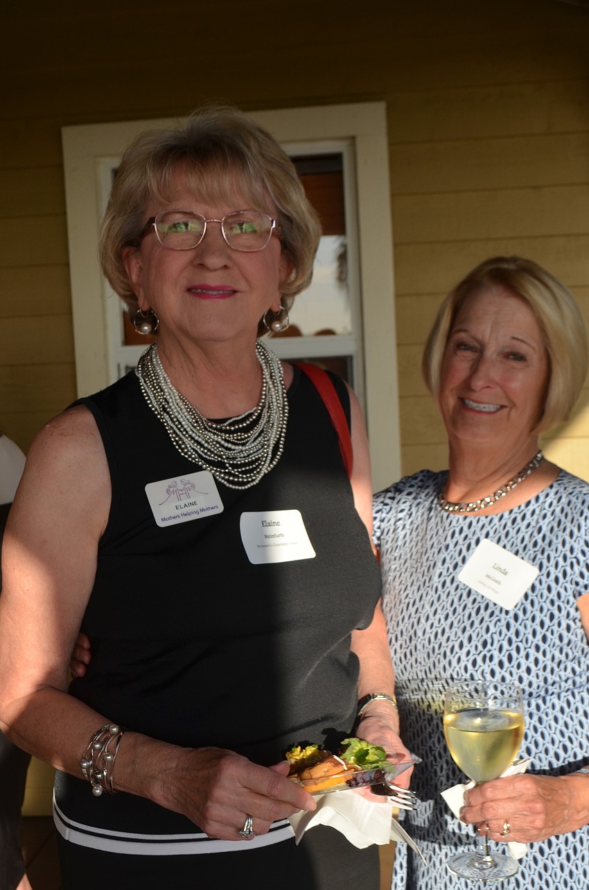 Elaine Steinfurth of the Women's Charitable Fund and Linda McGrath of Giving for Hope support the event.