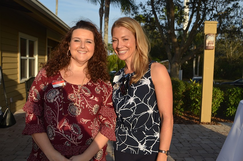 Pamela Stith, a guest of Jen Steube of Sisterhood for Good, do some networking on the patio.