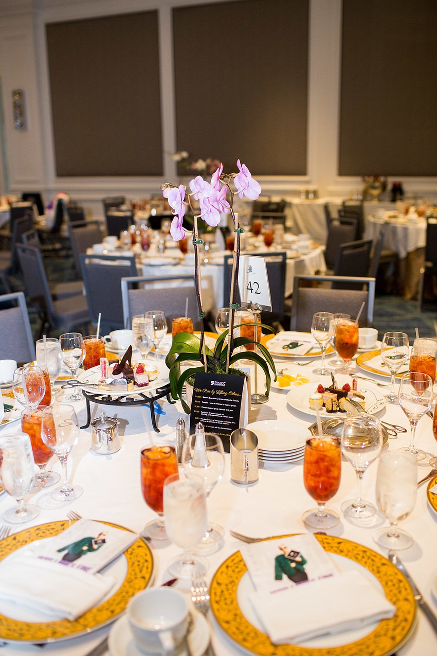 Orchids of all colors centered the tables.