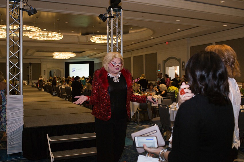 Matthew McGee, aka Joan Rivers, greets guests in the ballroom.
