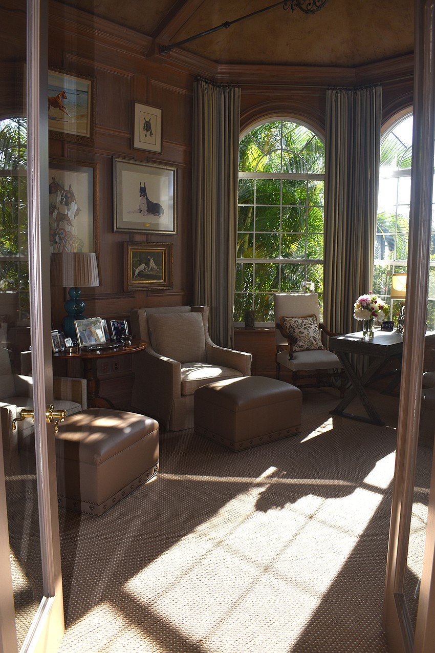 To the right of the main entrance, a study full of pictures of boxers lets sunlight into the home. The Andersons used to show boxers as hobbies. This room highlights their awards earned throughout the years.