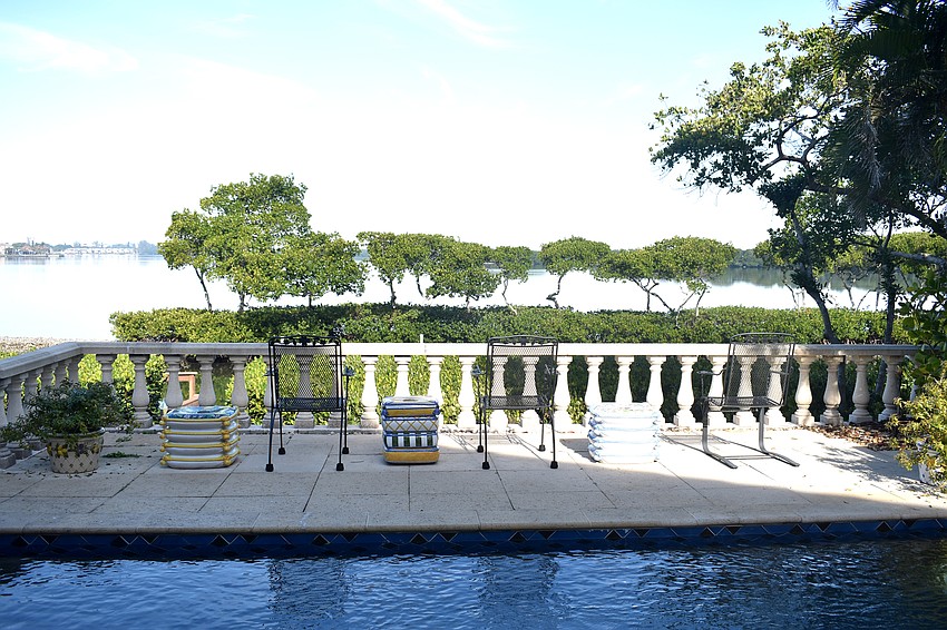 Off of the family room, a pool and views of an inlet of Sarasota Bay.