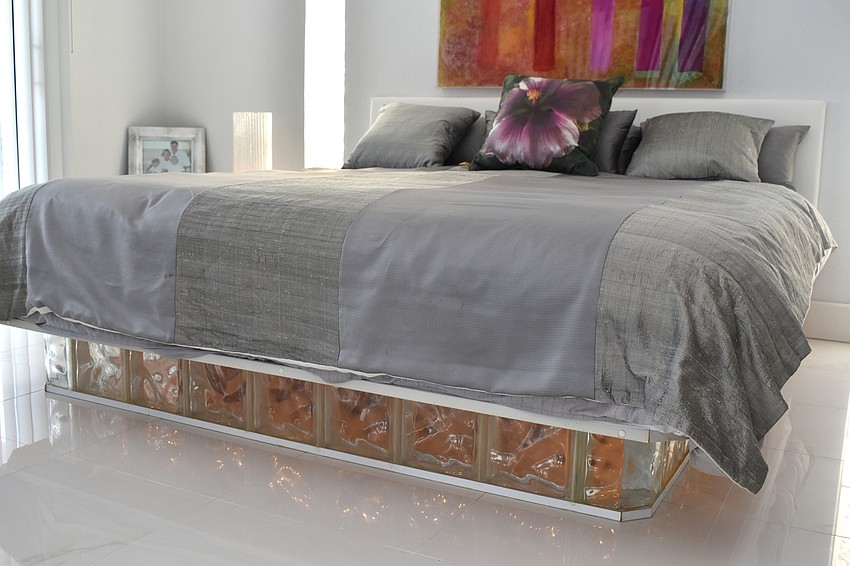 A guest room on the first floor features a bed with special lighting on the bottom.