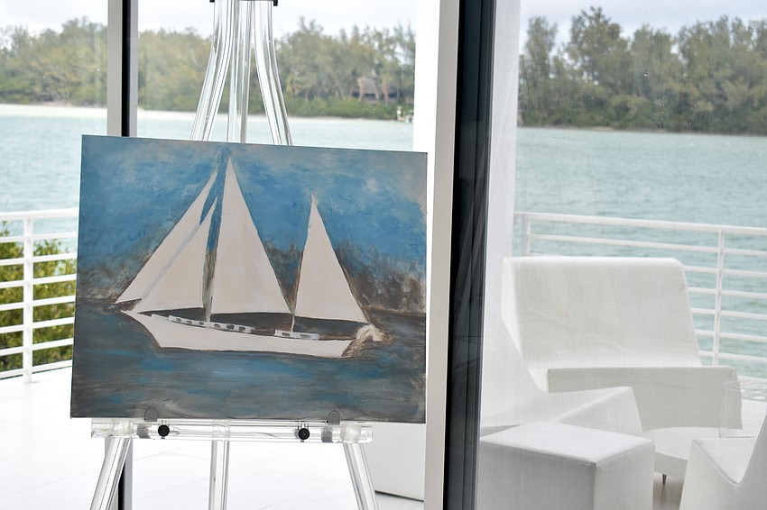 Lila Gerich is in the midst of painting this sailboat while overlooking her home view of Jewfish Key.