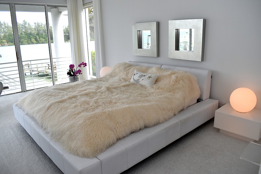 The master bedroom is situated off of the kitchen with views of Sarasota Bay and Jewfish Key.