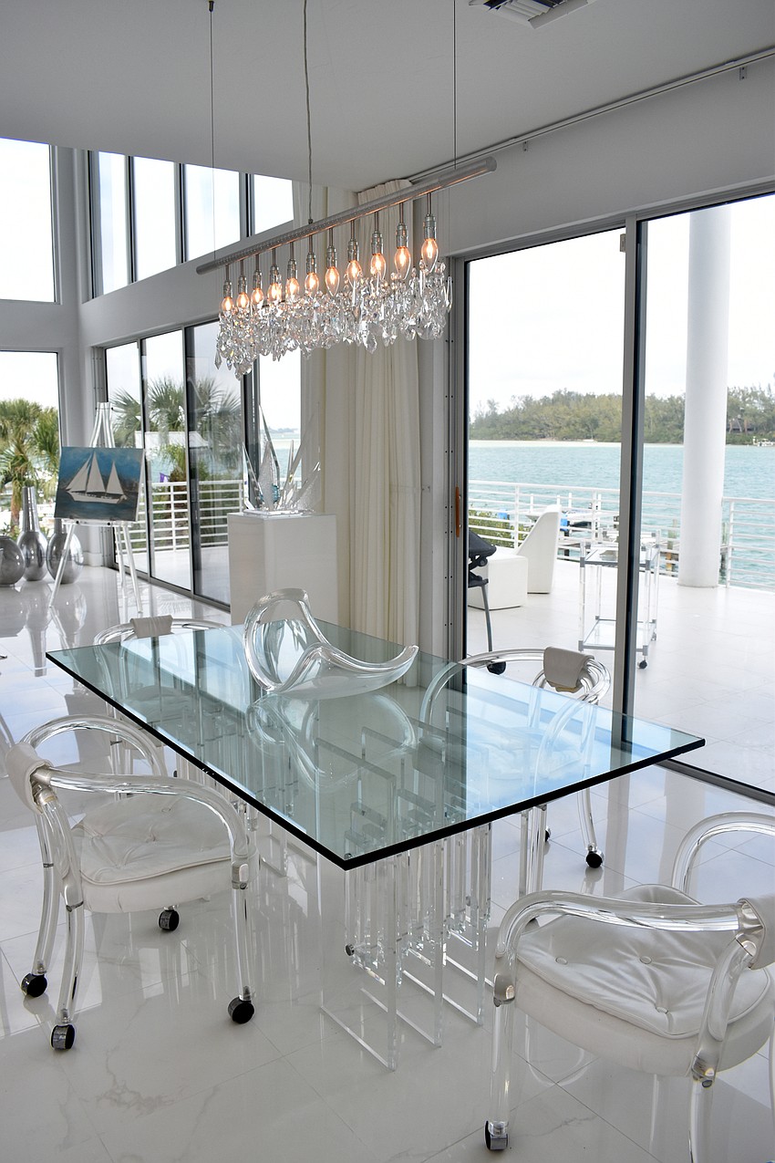 A kitchen table, situated off the kitchen and living room, overlooks Sarasota Bay onto Jewfish Key.