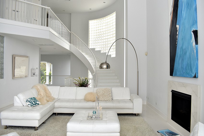 A staircase, with a light-up railing, leads to the third floor.