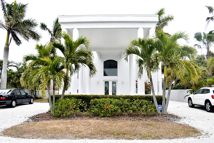 A circular driveway offers plenty of parking for visitors in the Village home.