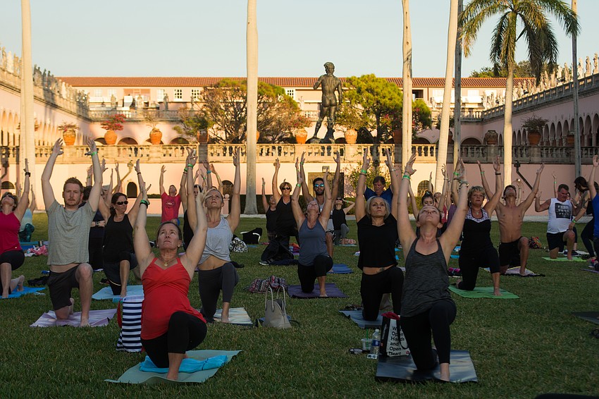 Dozens of yogis followed instructors through a relaxing practice.