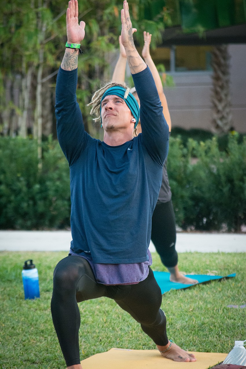 Joshua Martin leads participants through a variety of poses.