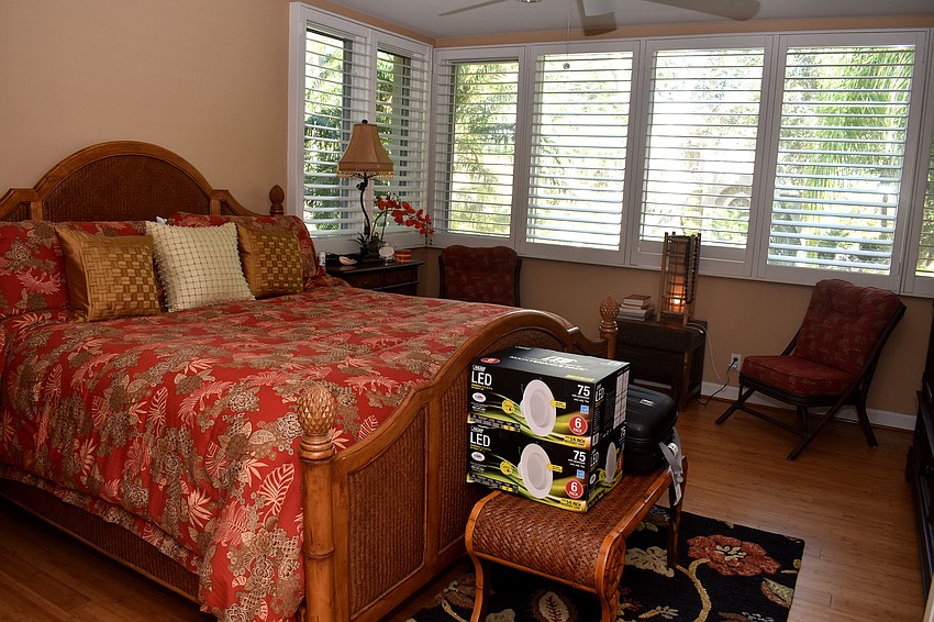 The master bedroom overlooks the front yard of the home.