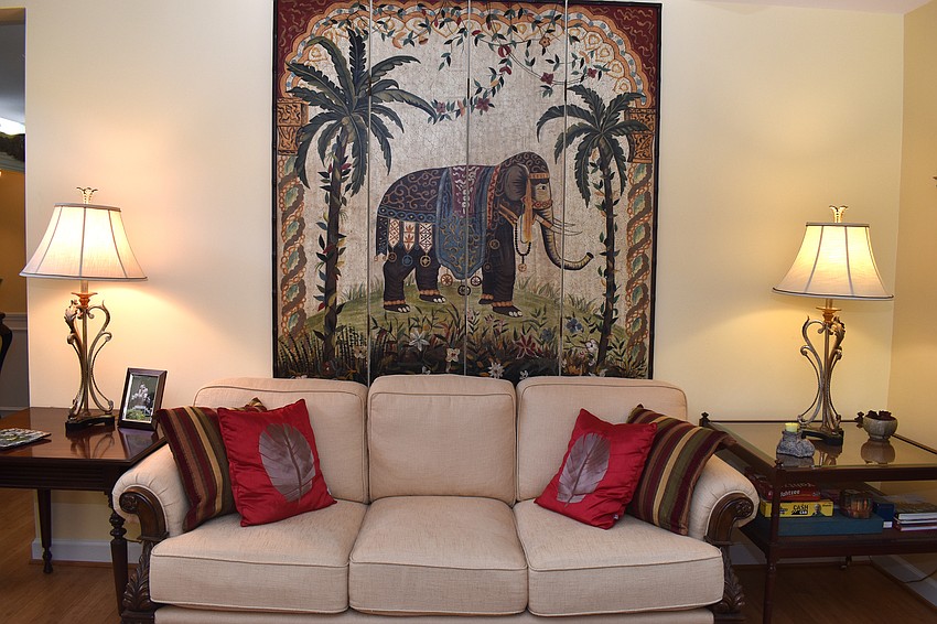 The living room is decorated with hints of bohemian accents.