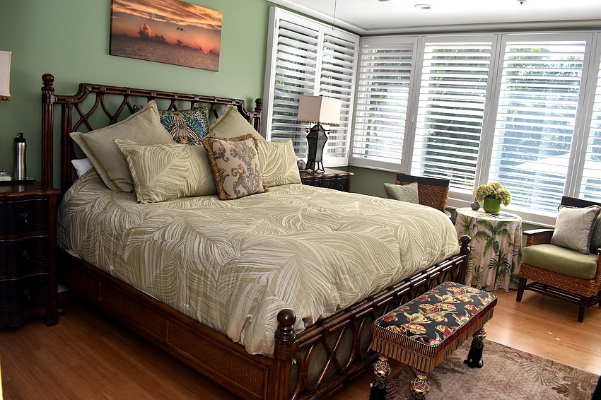 The master bedroom has access to the outdoor, saltwater pool.