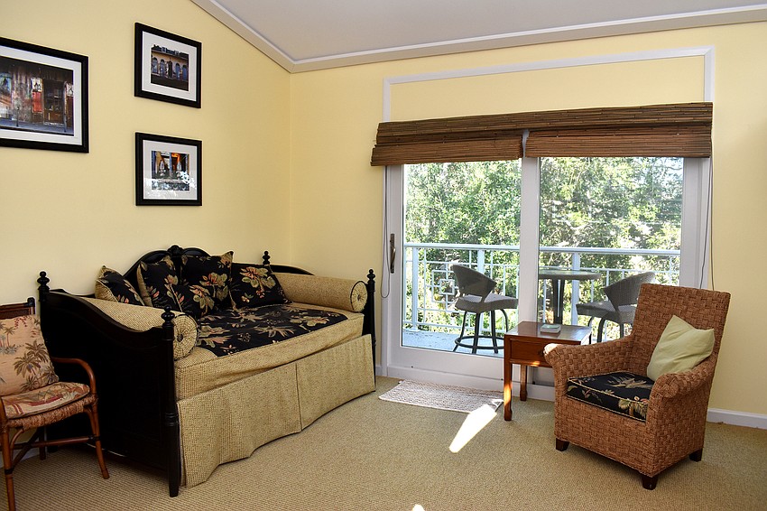 The tropical vibe of the home continues onto the second floor where two more rooms are located.