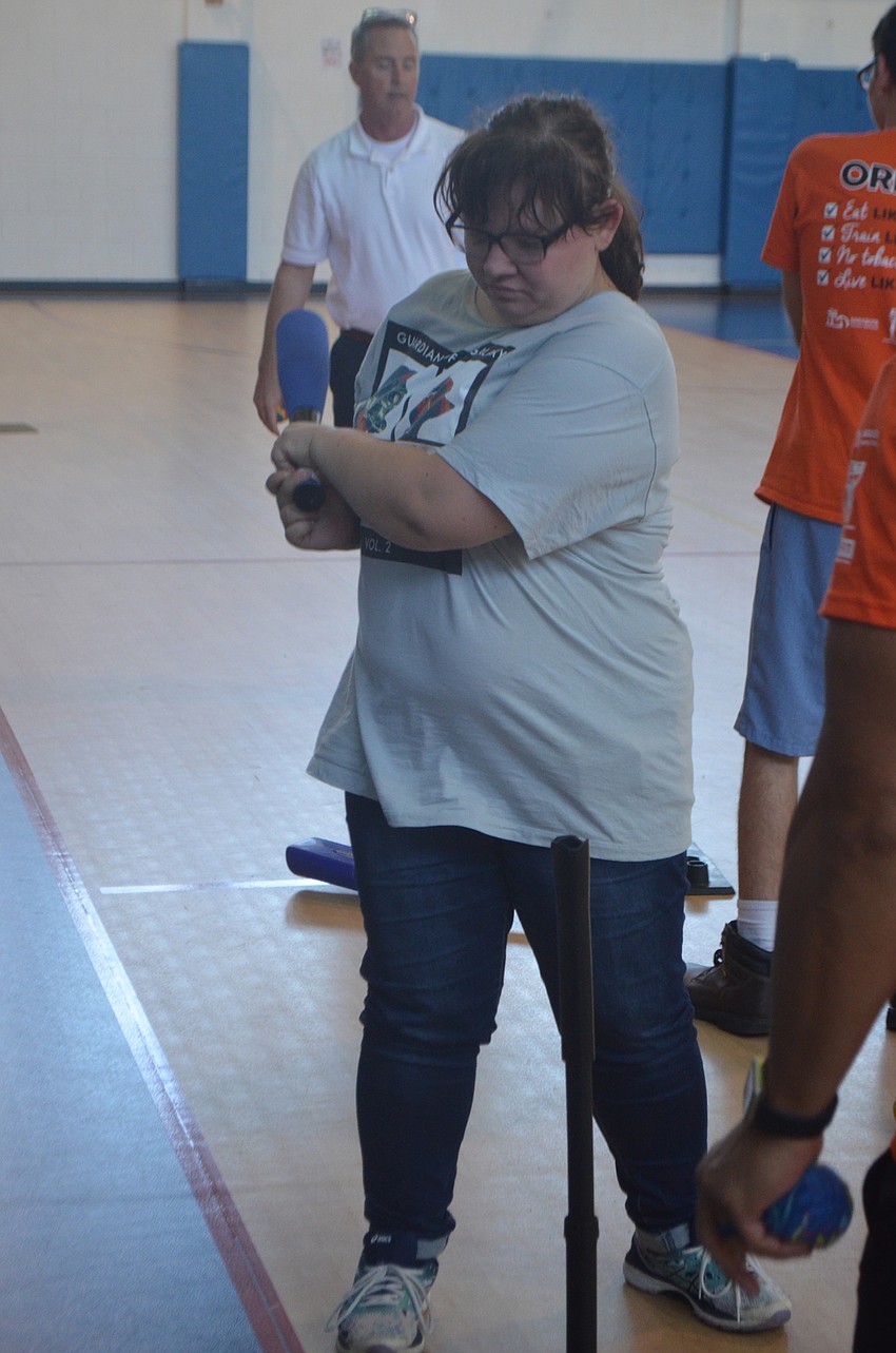 Oak Park School student Samantha Martin takes a swing off the tee.