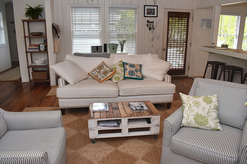 Upon entering, guests walk into a cozy living room.