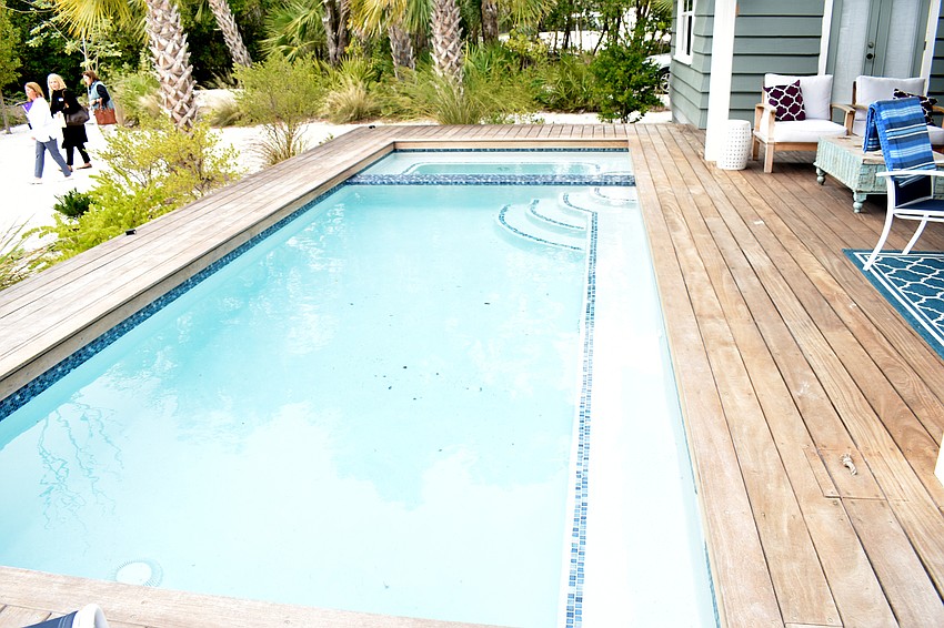 A pool and hot tub finish off the patio outside.
