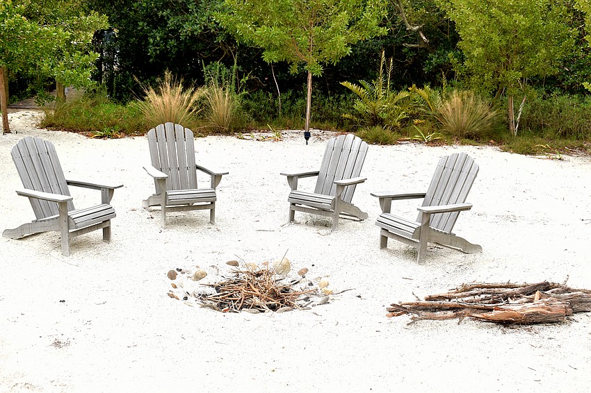 A fire pit complete with chairs finishes off the backyard.