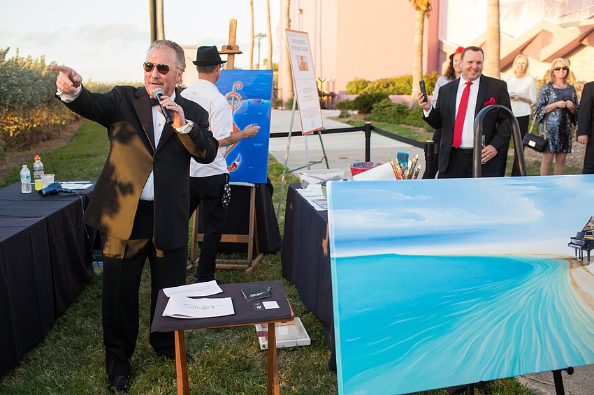 Michael Klauber was the auctioneer for the live auction on Stuart Bailey's paintings. The paintings sold as a pair for $20,000.