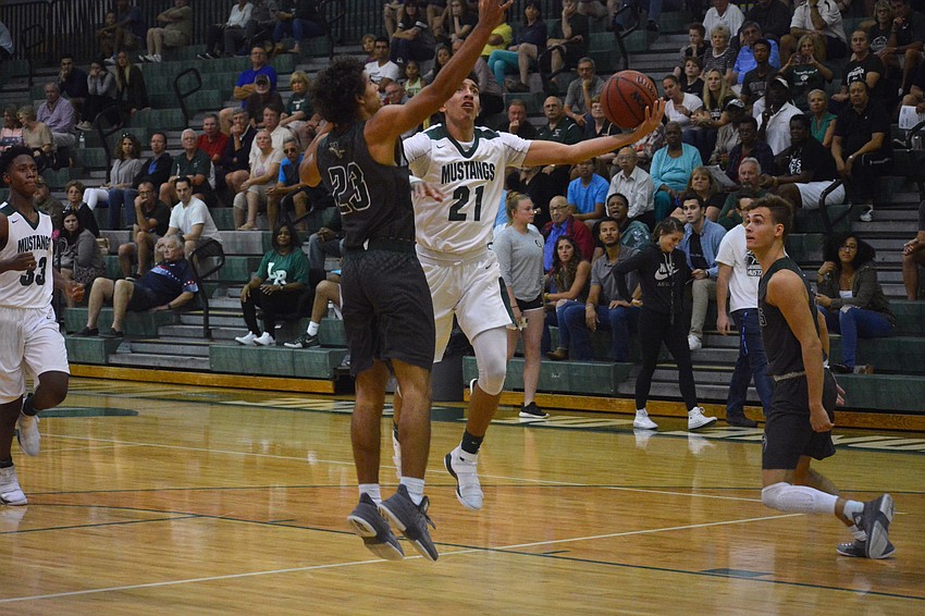 Senior Evan Spiller evades a Venice defender for a layup. Spiller finished with eight points.