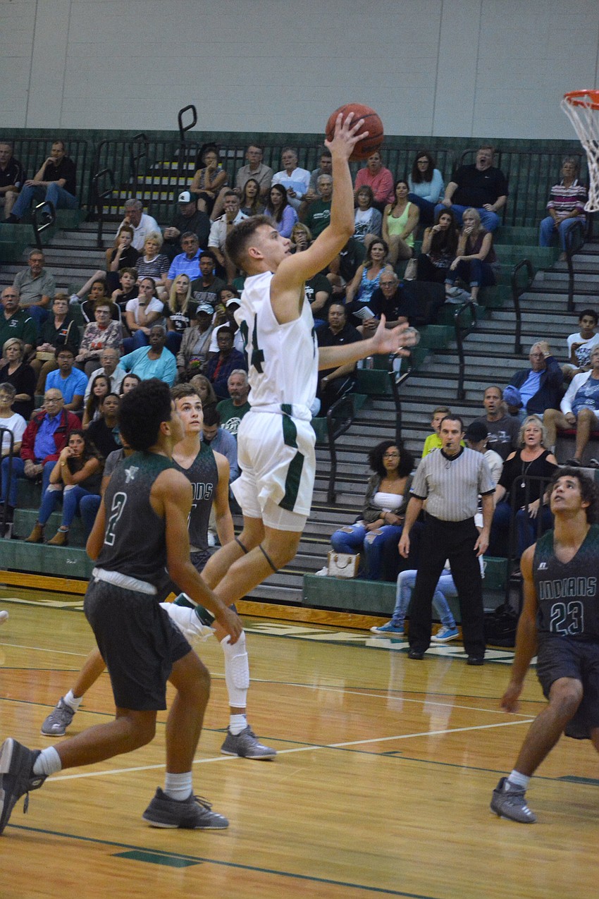 Senior Jack Kelley flies through the Venice defense for a layup.