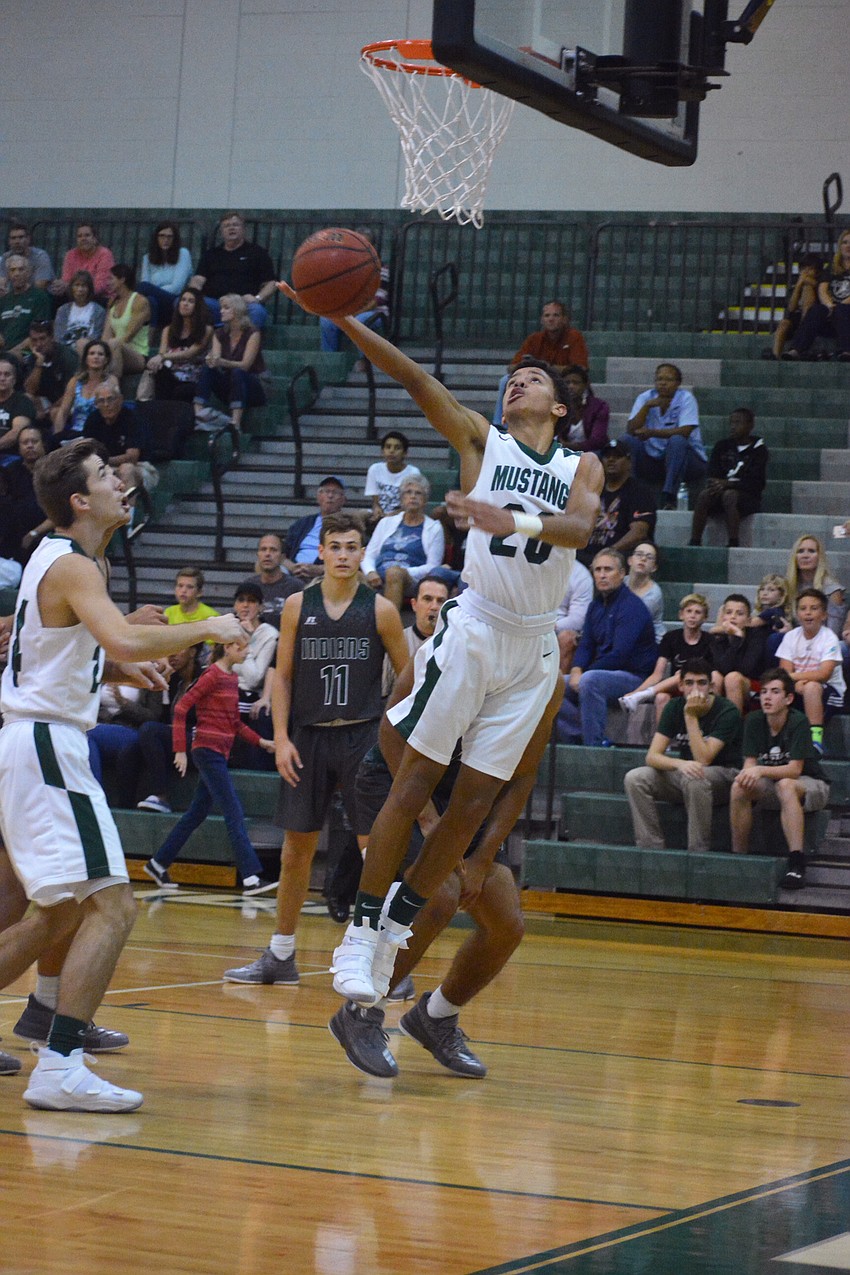 Sophomore Keon Buckley hits a reverse layup attempt. He finished with 12 points, the most on the Mustangs.