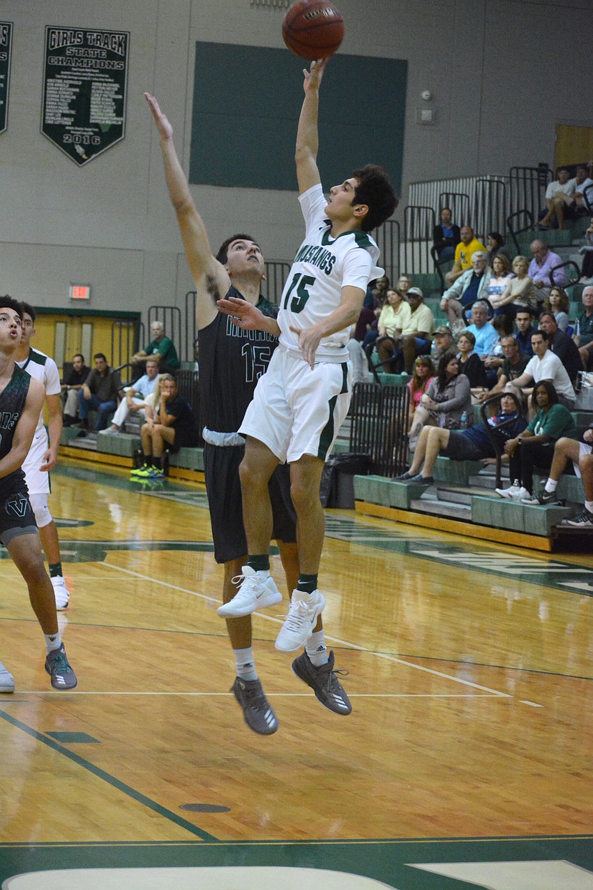 Sophomore guard Christian Perez floats a shot over the Venice defense. Perez scored two points.