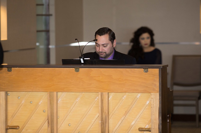 Steven Aguilo-Arbues plays the piano for his fellow Opera singers.