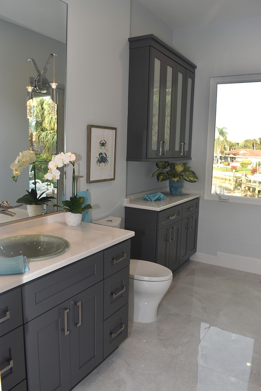 A guest bathroom leads to an outdoor patio.