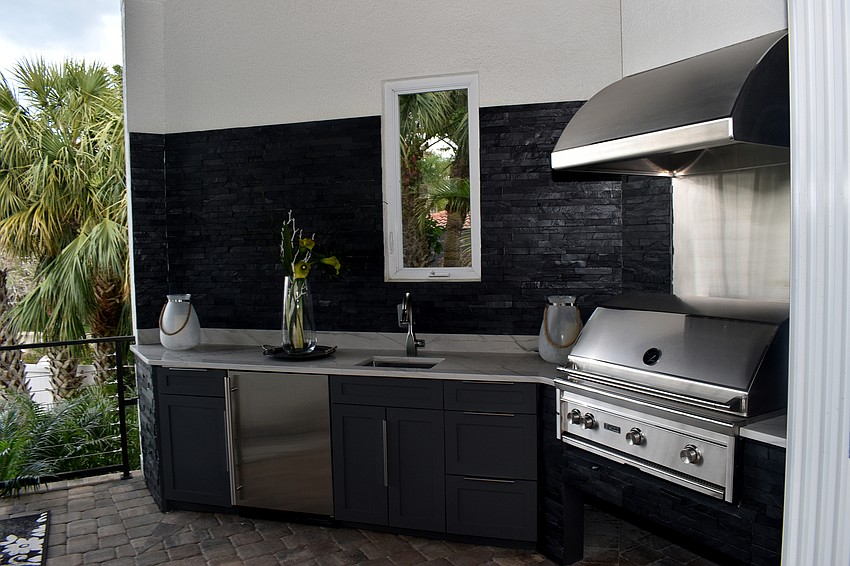 On the outdoor patio, guests can utilize a kitchen and grill.