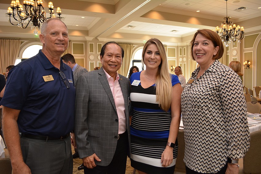 Sarasota Christian School High School Principal Pete Conner poses with Rotary's Fred Lopez, Meals on Wheels PLUS's Stephanie Grepling and fellow Sarasota Christian employee Laura Randall.