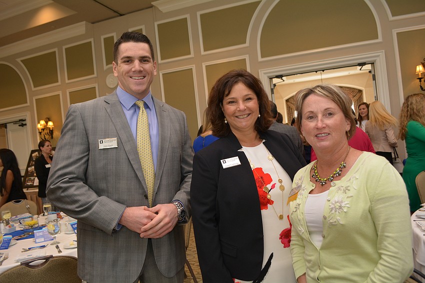 Alex Gualt and Laurel Lorriveau, of The Otto Group at Hightower, greet fellow Alliance member Judy Athari, of Buffalo Lodging.