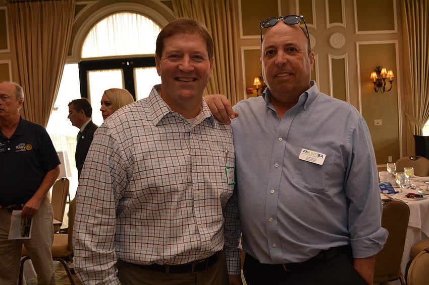 Shawn Hanlon, of BBG, visits with Al Benincasa, of Total Air Solutions.